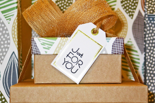 Examples of gifts wrapped in eco-friendly materials with text "Just for you"