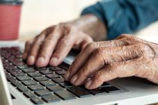 elderly person on computer