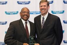 Andrew Lofton holds Friend of Housing Award
