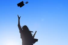 student celebrating graduation