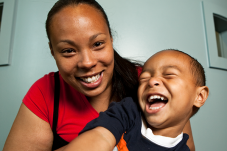 mom and son smiling 