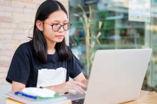 Teen girl at laptop computer