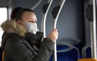 Woman on public transit wearing mask