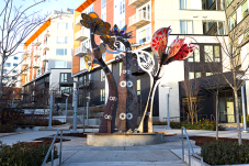Yesler Blossoms sculpture with building in the background
