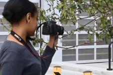 Young filmmaker holding camera