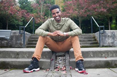 Young man sitting on steps
