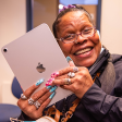 Resident holding an ipad