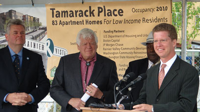 Mayor Greg Nickels, Congressman Jim McDermott and Resident Ed Frazier listen as HUD Secretary Donovan addresses a groundbreaking crowd of 200 on Aug. 10.