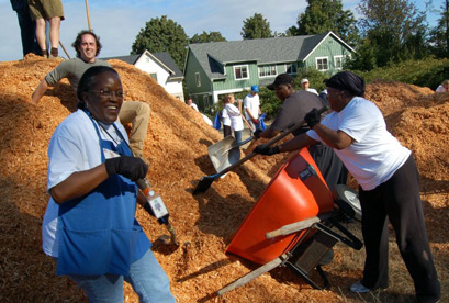 Volunteers work hard to build a playground in a day at High Point's Bataan Park. Photos courtesy of Neighborhood House.