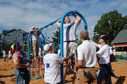 Volunteers work hard to build a playground in a day at High Point's Bataan Park. Photos courtesy of Neighborhood House.