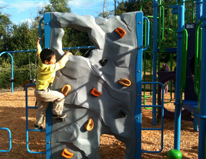 Neighborhood children came out to play during the playground's informal grand opening celebration on Sept. 27.