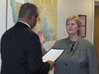 Mary McBride is sworn in by HUD Deputy Director Ron Sims at the HUD headquarters in downtown Seattle March 2.