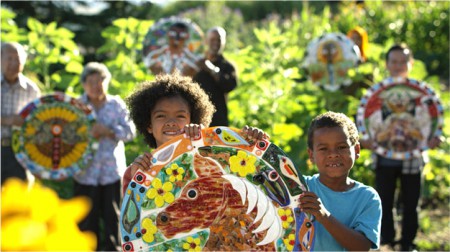 Children hold medallions
